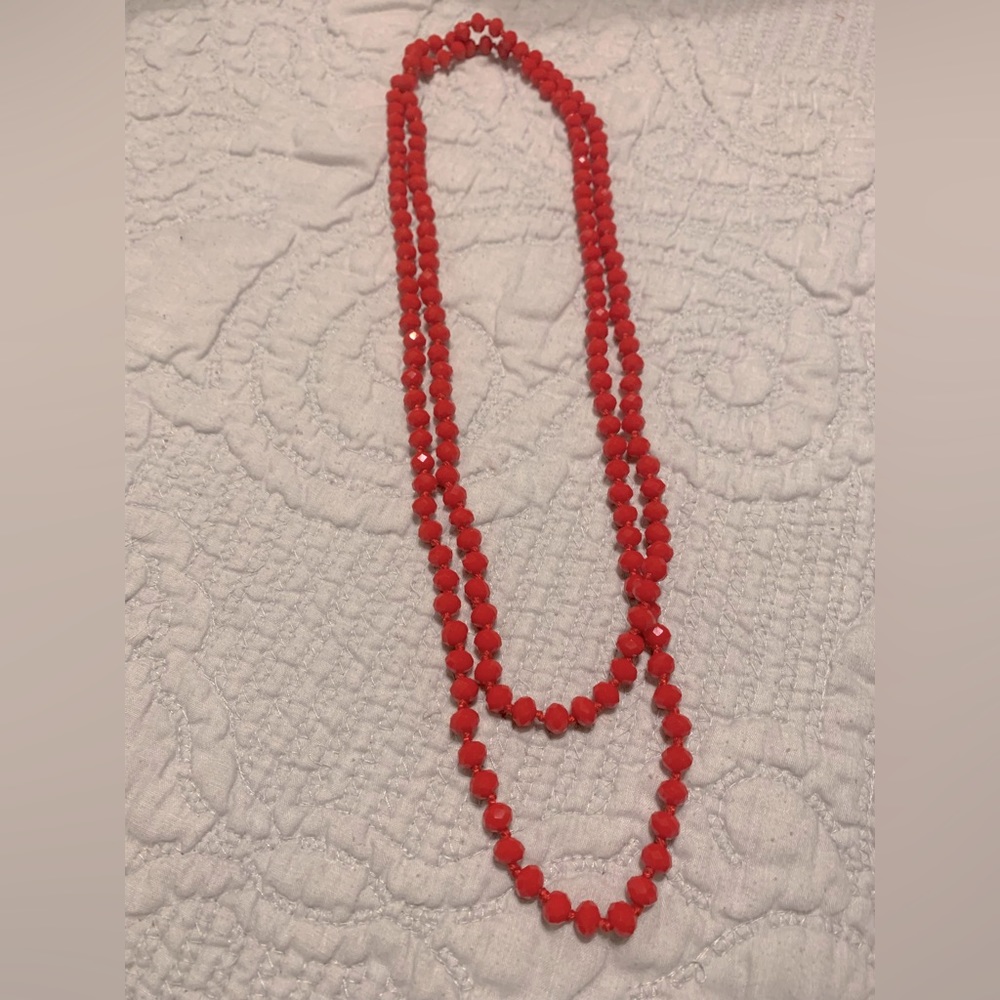 Long red beaded necklace